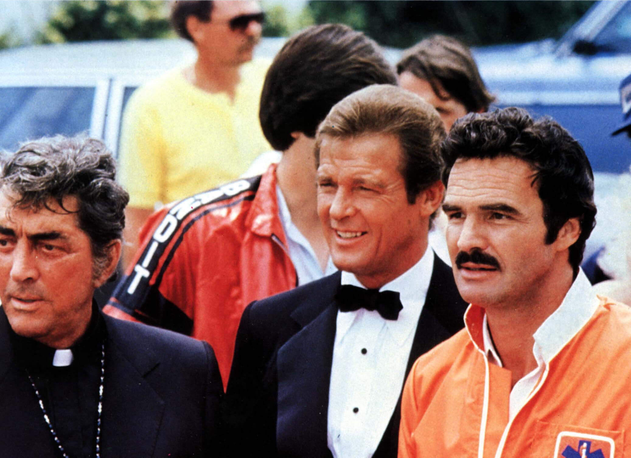 Roger with Dean Martin (left) and Burt Reynolds (right) in Canonball Run (1981). RGR Collection / Alamy Stock Photo.