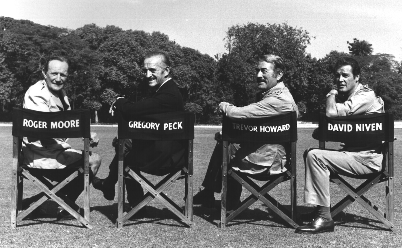 Trevor Howard, David Niven, Gregory Peck and Roger Moore during filming of The Sea Wolves (1980).