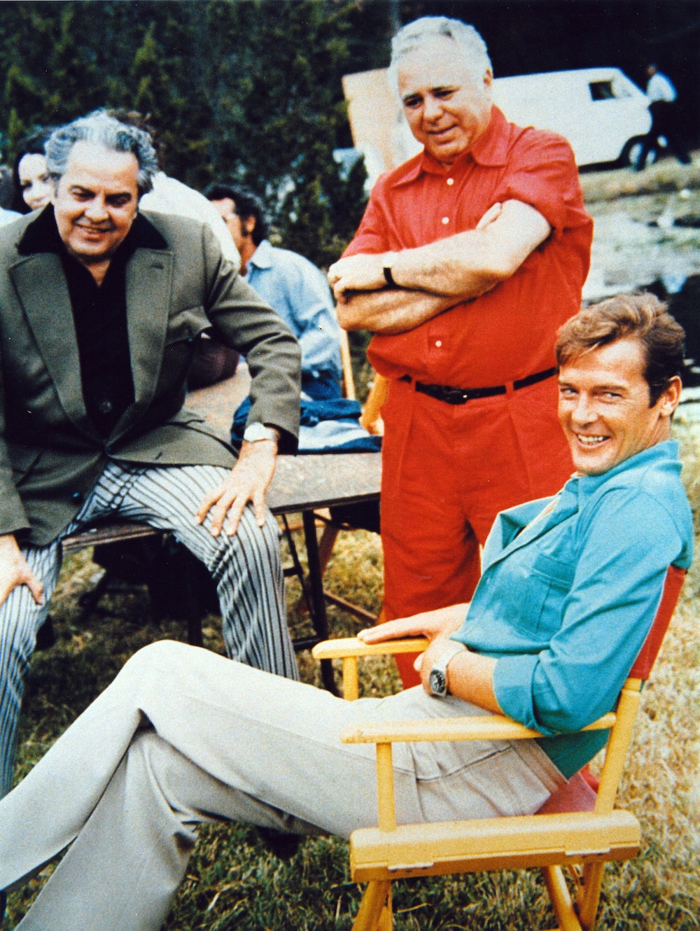 Roger with Bond producers Albert R. "Cubby" Broccoli (left) and Harry Saltzman (right) on the set of Live and Let Die (1973).